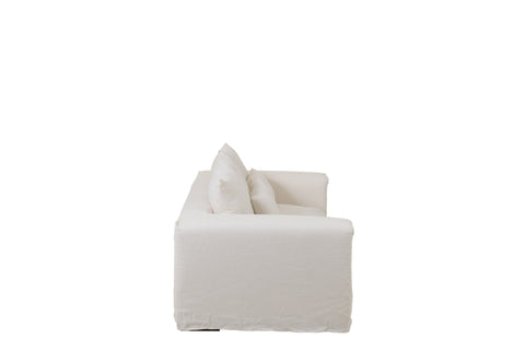 Zijkant van J-Line Monaco zetel met witte linnen hoes in Mashmallow White.