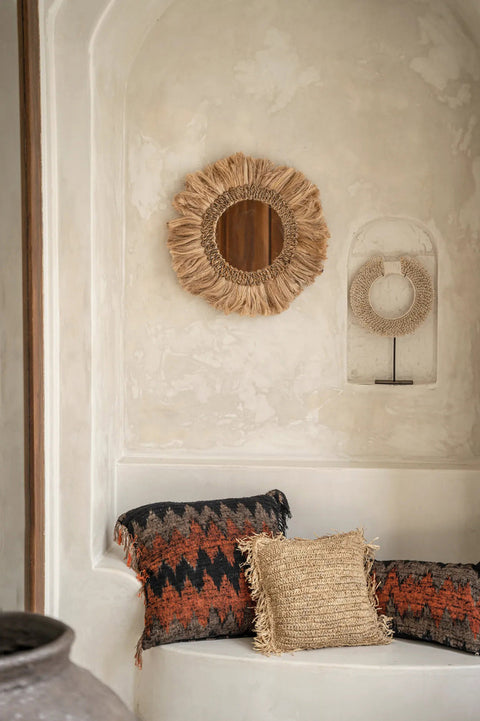 Schelpenketting The Papua boven bed als bohemian wanddecoratie