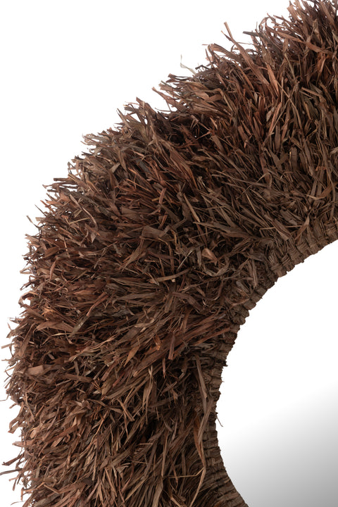 Detail van handgevlochten rieten rand van spiegel Sisal